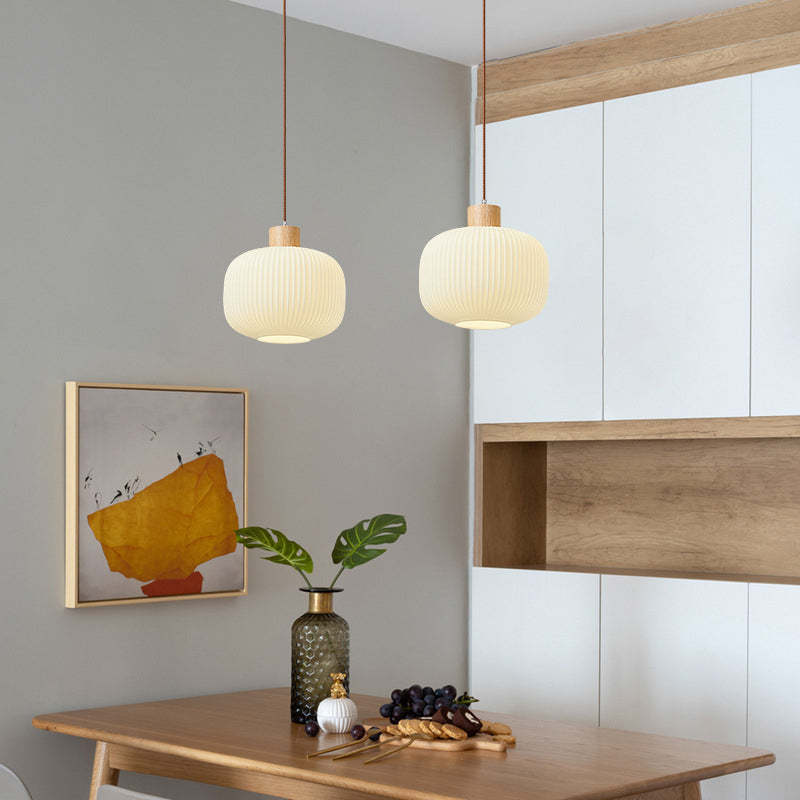 Ozawa wood glass pendant lights above dining table. Ozawa Modern Wood Glass Pendant Light