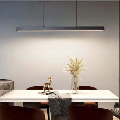 Edge LED pendant light over modern dining table. Edge Modern Linear Metal LED Pendant Light