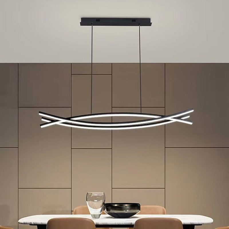Modern linear pendant light in dining room setting.