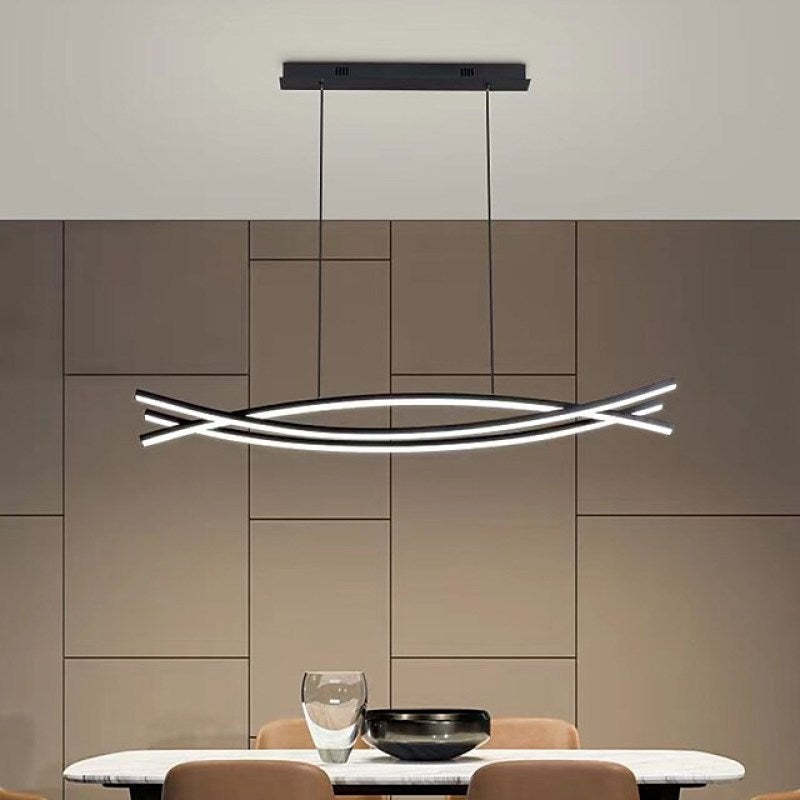 Modern linear pendant light in dining room setting.