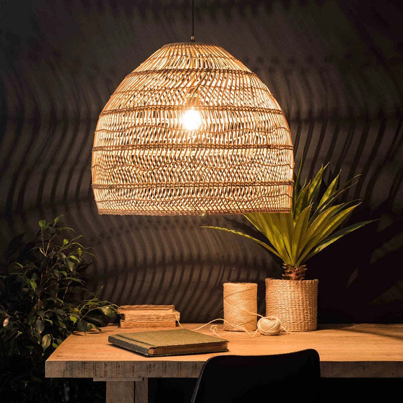 Muto Rattan Pendant Light over wooden table