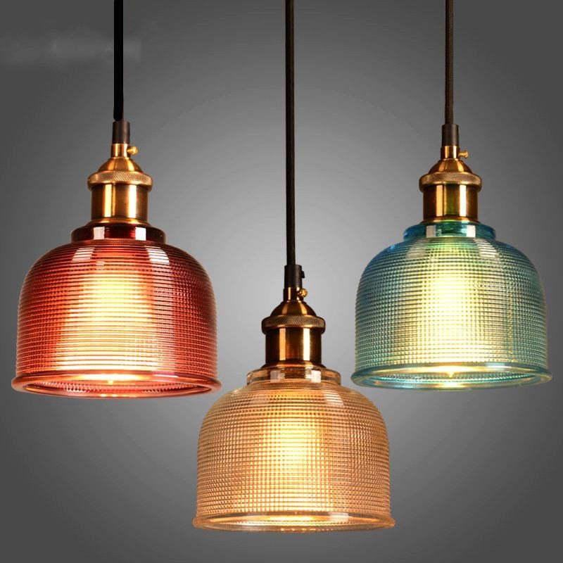 Art Deco glass pendant lights in red, amber, and blue