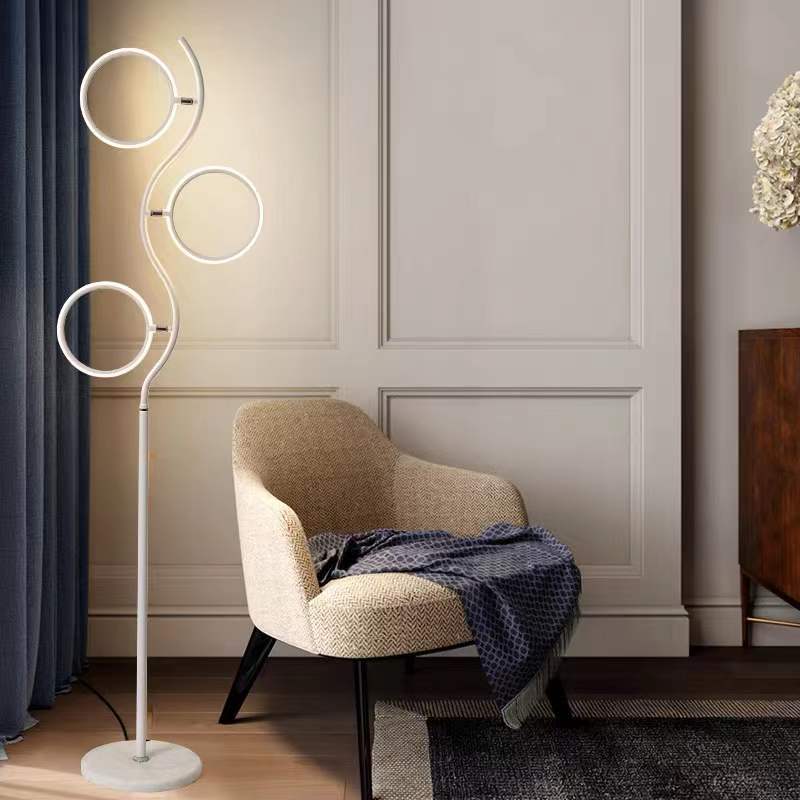 Modern floor lamp in living room with armchair