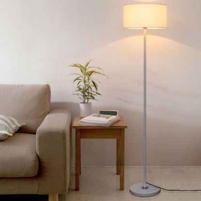 Eryn cylinder floor lamp near sofa