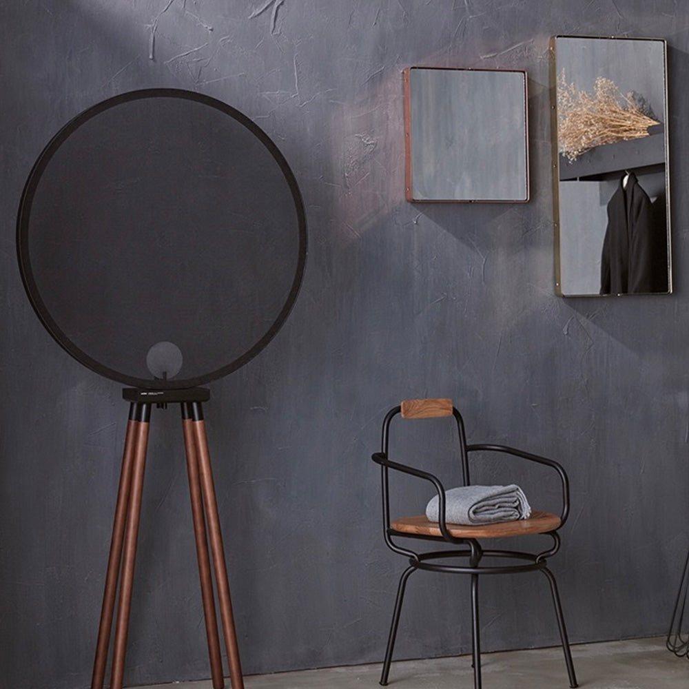 Cooley floor lamp: Modern design, metal shade and wood legs.