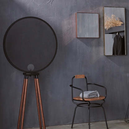 Cooley floor lamp: Modern design, metal shade and wood legs.