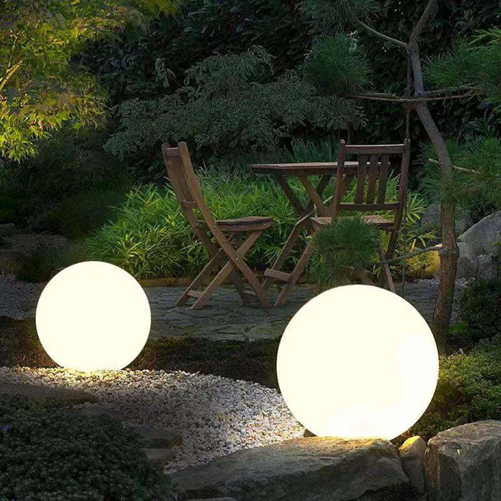 Elif Globe Outdoor Lights illuminating garden
