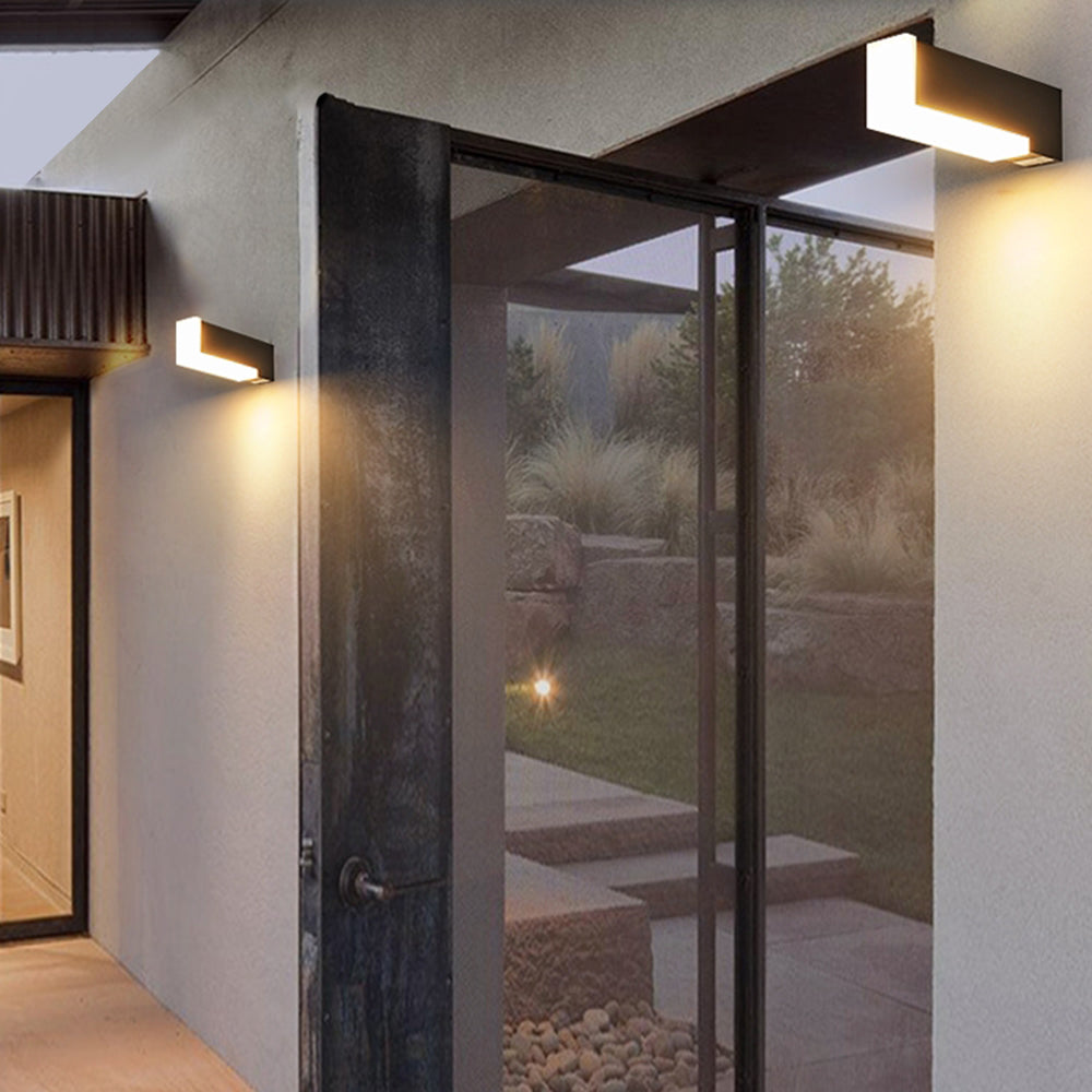 Outdoor wall lamp illuminating exterior entrance