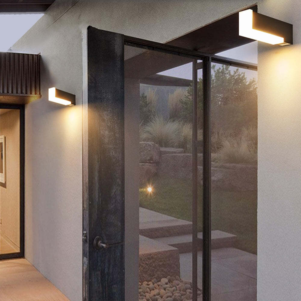 Outdoor wall lamp illuminating exterior entrance