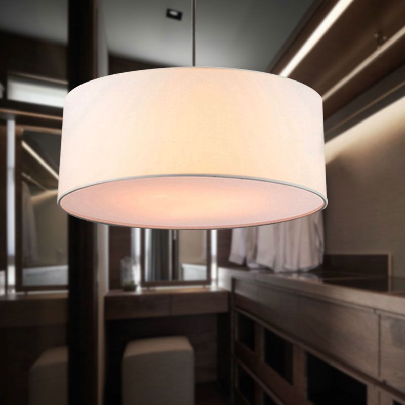 Modern fabric drum pendant light in bedroom setting
