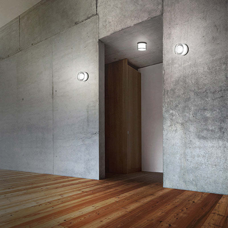 Valentina Modern Mini Drum Wall Lamp illuminating a modern interior space