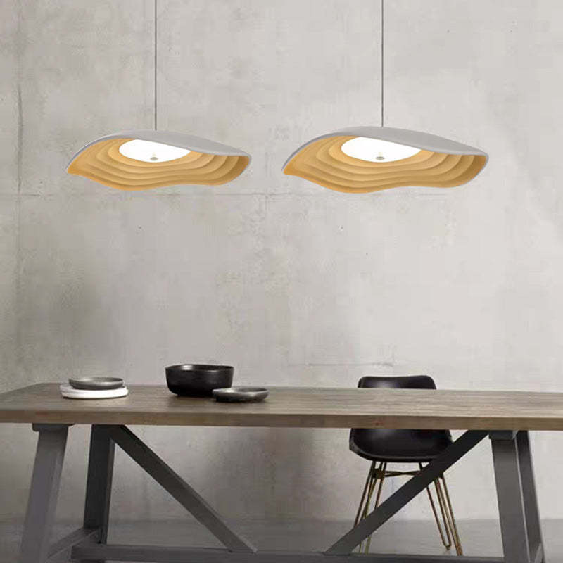 Resin LED pendant lights above dining table