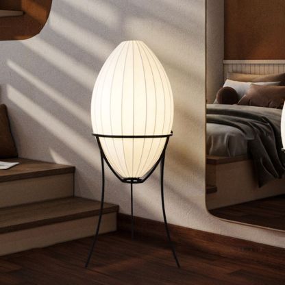 Renée egg-shaped floor lamp in bedroom setting