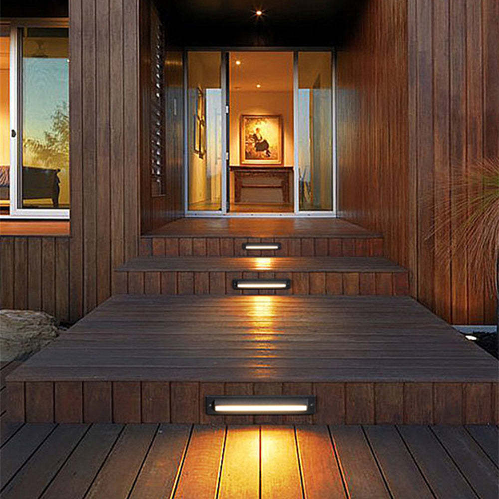 Orr Outdoor Deck Step Light illuminating wooden deck