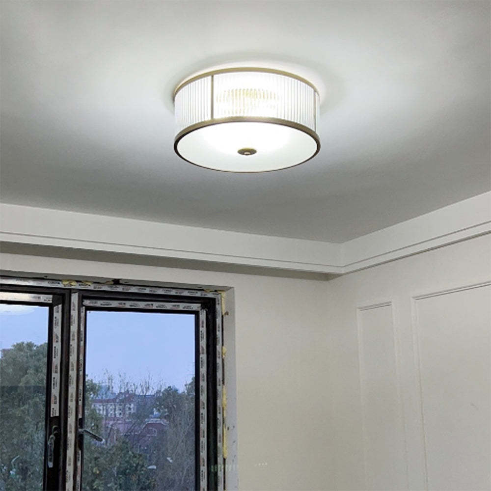 Gold Alessio glass flush mount ceiling light in bedroom