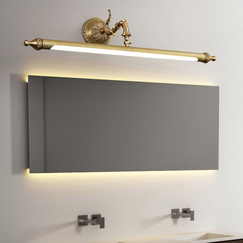 Félicie gold wall lamp above bathroom mirror. Vintage style.