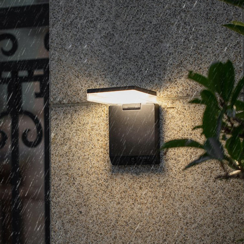 Minimalist Outdoor Wall Lamp illuminated in the rain, waterproof design