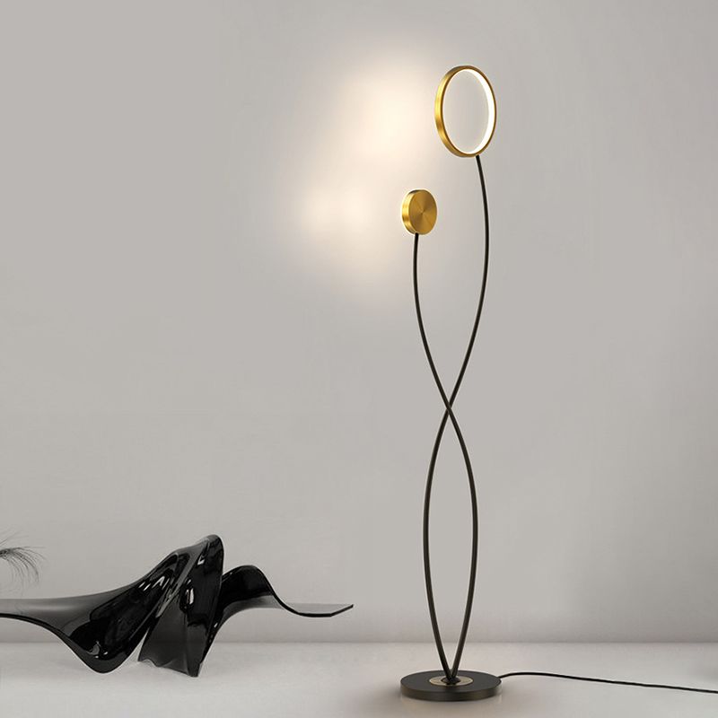 Modern floor lamp with gold accents and black metal stand