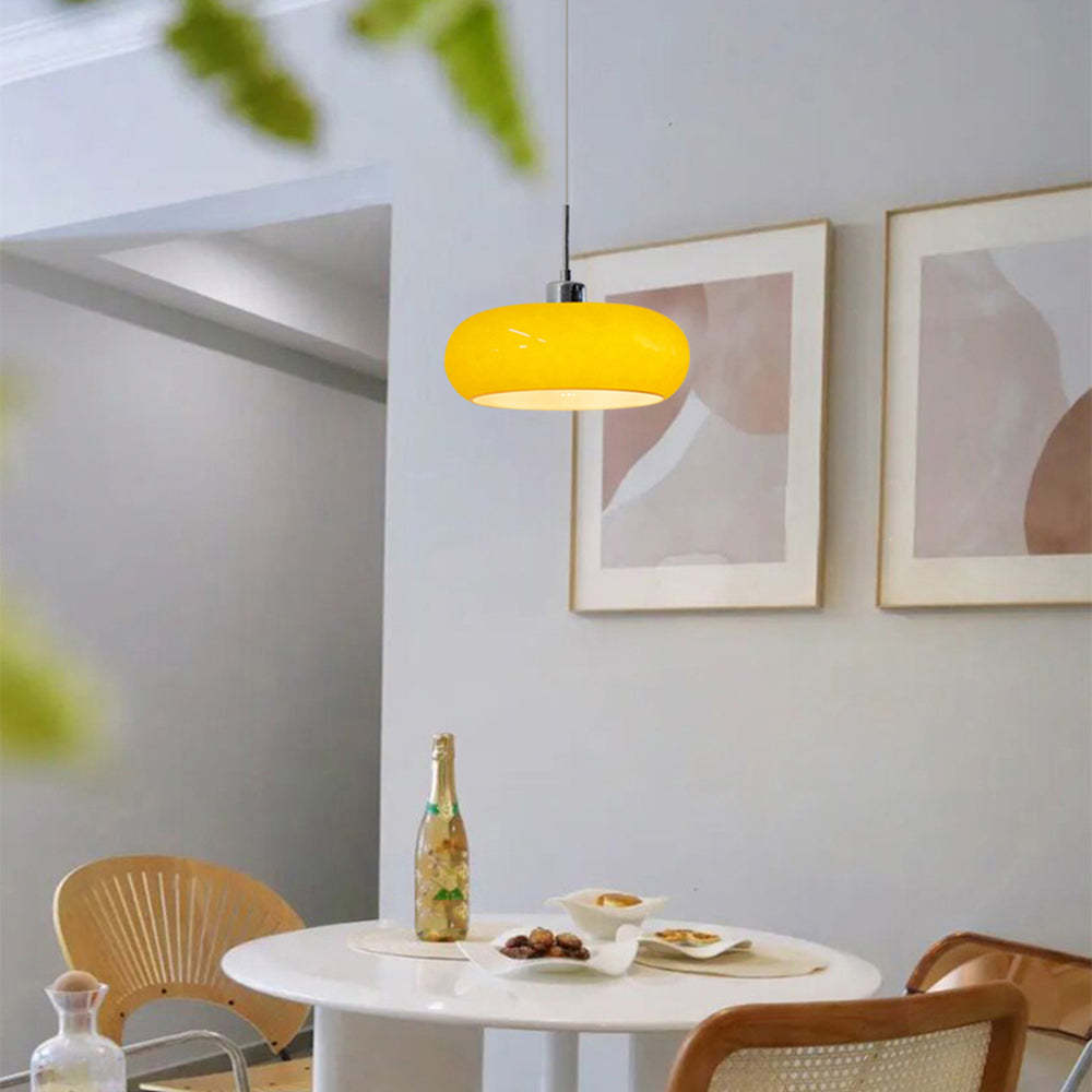 Yellow Hailie pendant light over dining table. Las Sola Lighting.