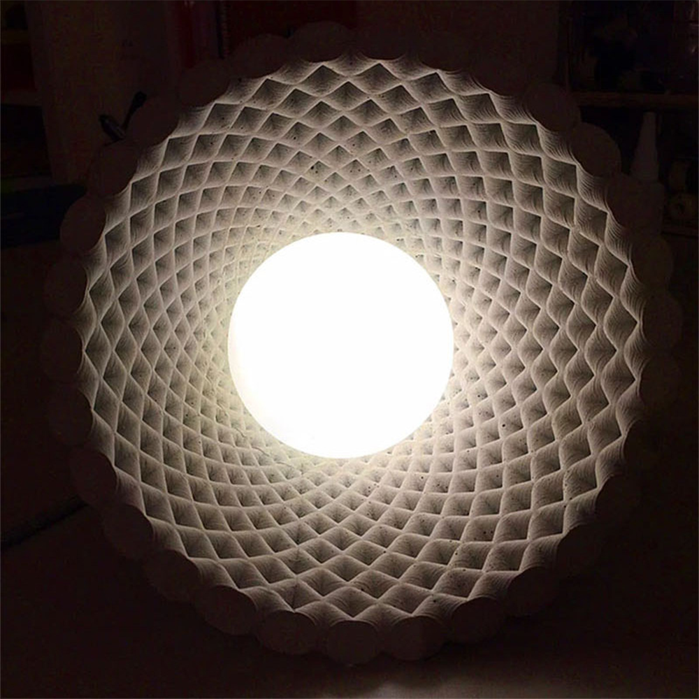 Hailie Cone Woven Pendant Light's illuminated interior