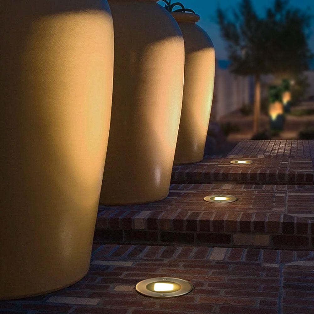 Outdoor deck step light illuminating stairs and garden, Orr modern design