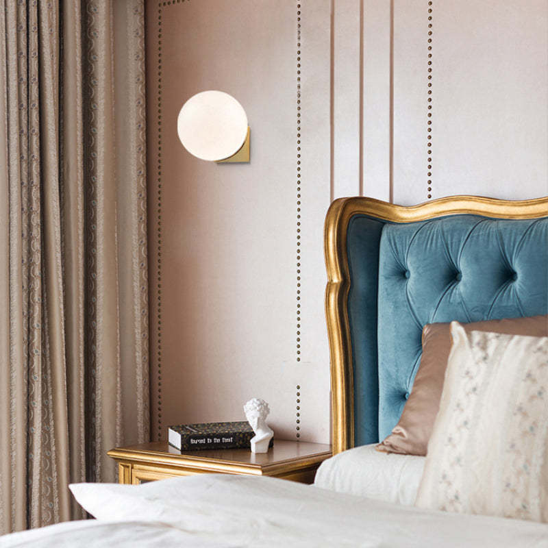 Valentina wall lamp illuminates bedroom with decor