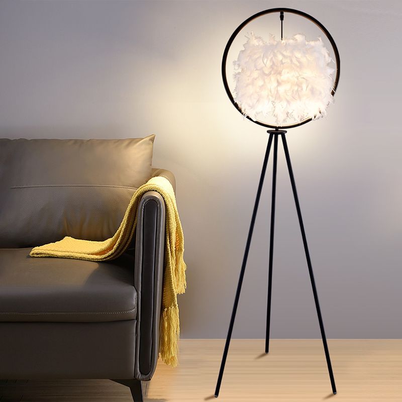 O'Moore Feather Ring Tripod Floor Lamp in a modern living room