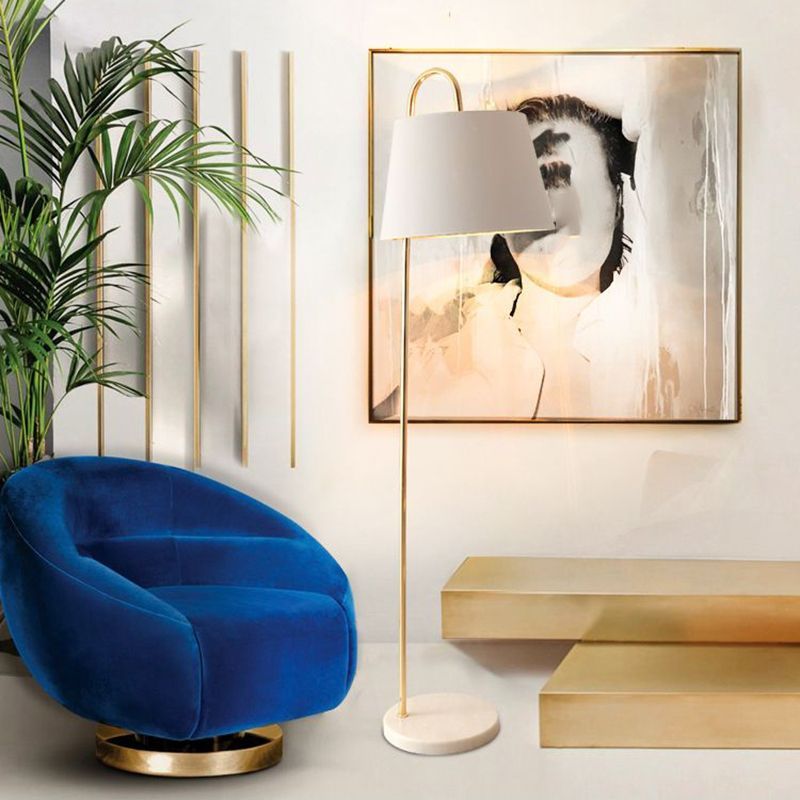 Eryn Floor Lamp in living room setting with art and blue chair