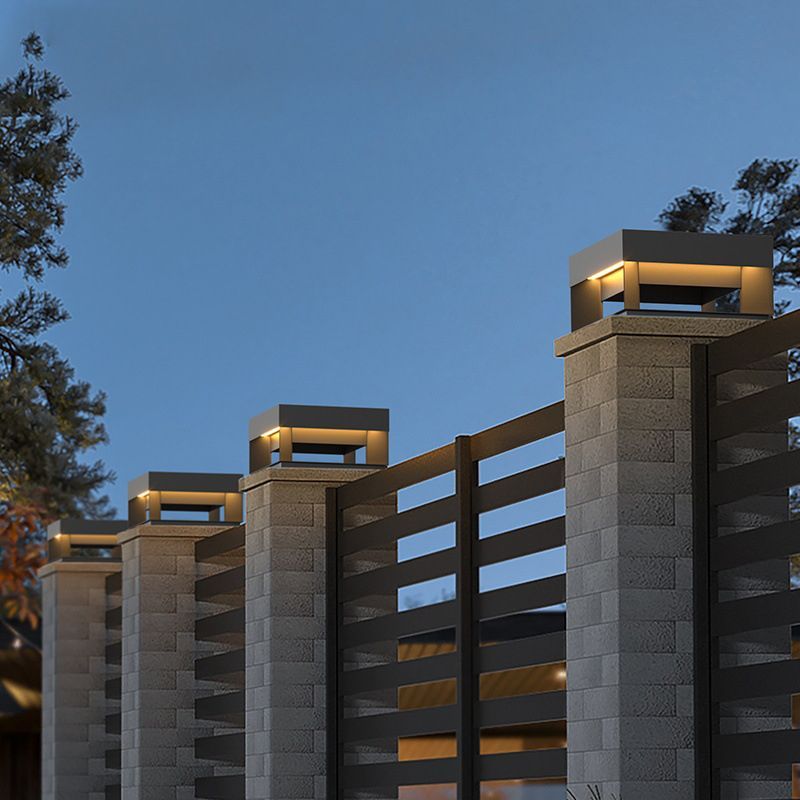 Riley square solar LED outdoor light on fence.