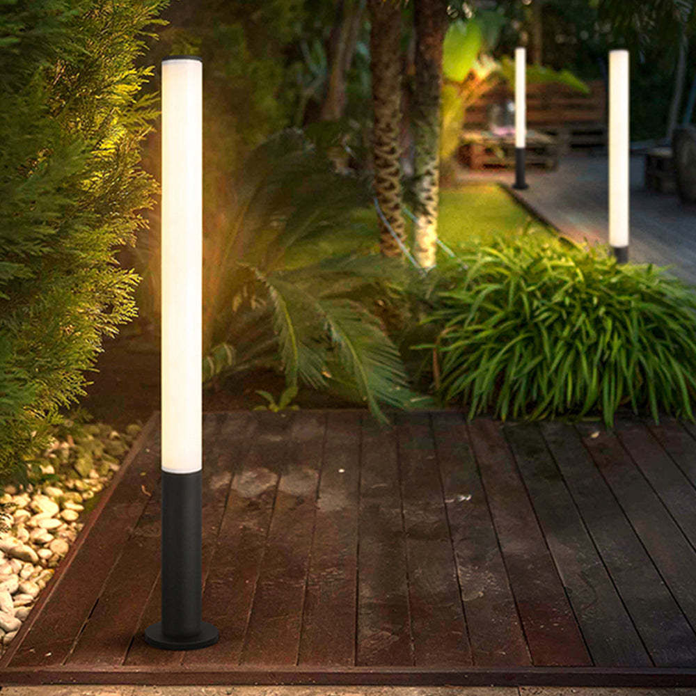 Pena outdoor ground light illuminating a garden pathway