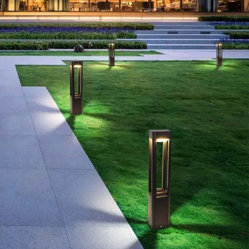 Pena Metal Rectangular Hollow Path Lights illuminating a garden