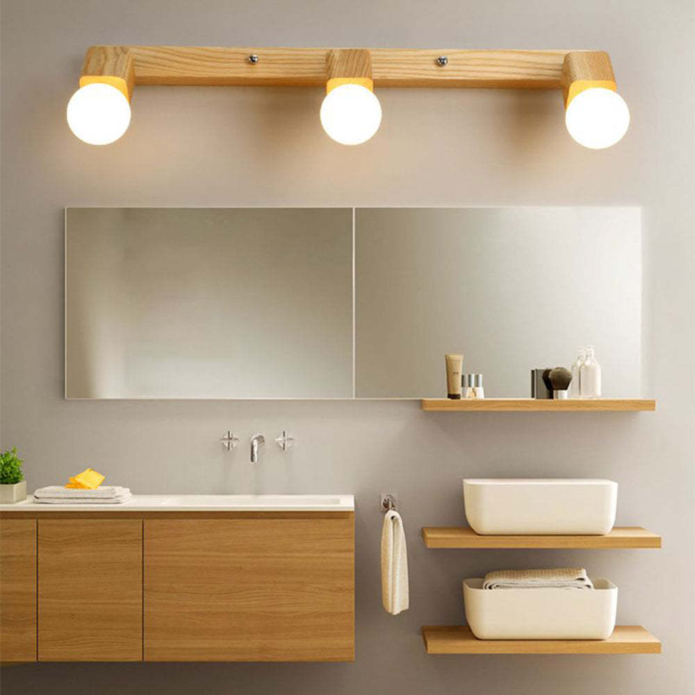 Modern wood and metal vanity light above mirror