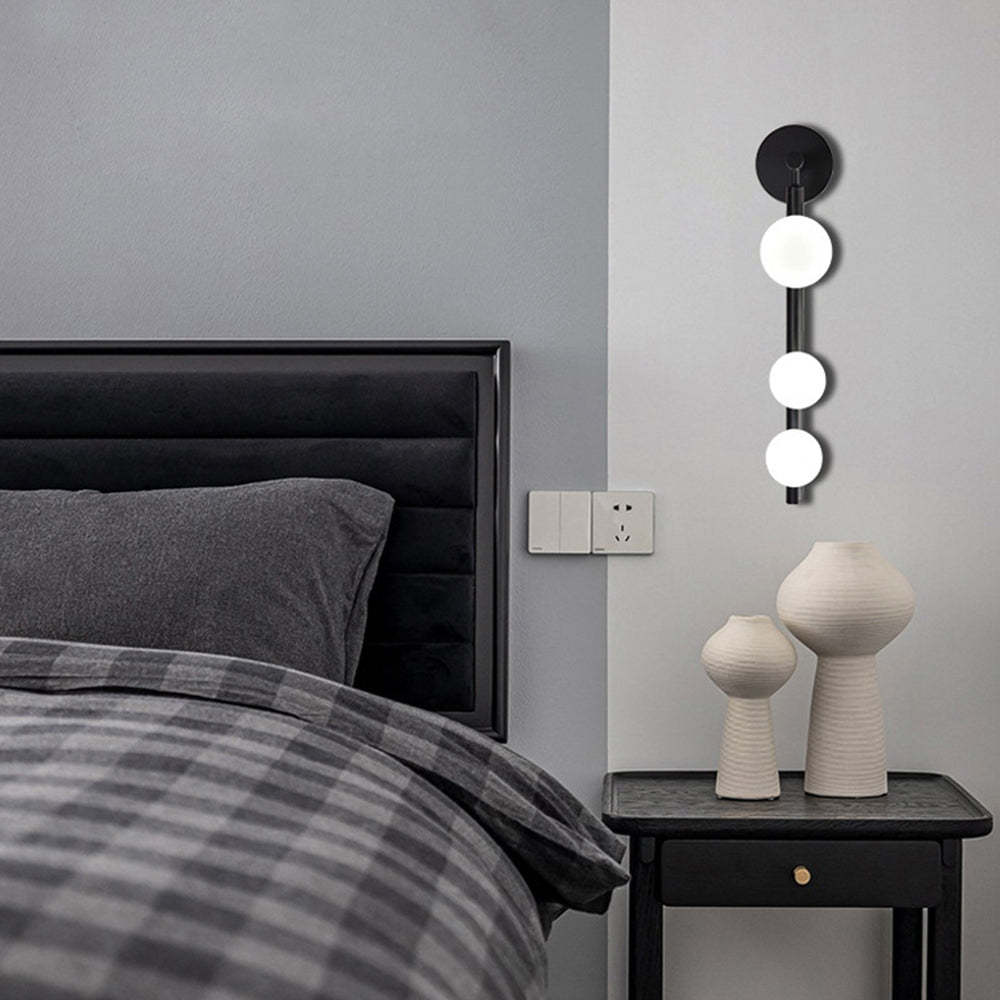 Modern globe wall lamp in bedroom | Las Sola Lighting