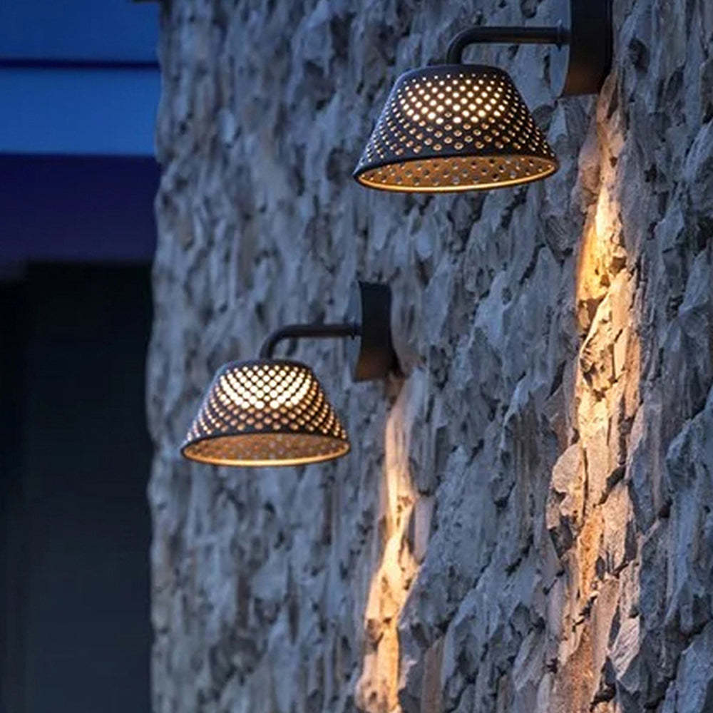Carins industrial outdoor wall lamp on stone wall.