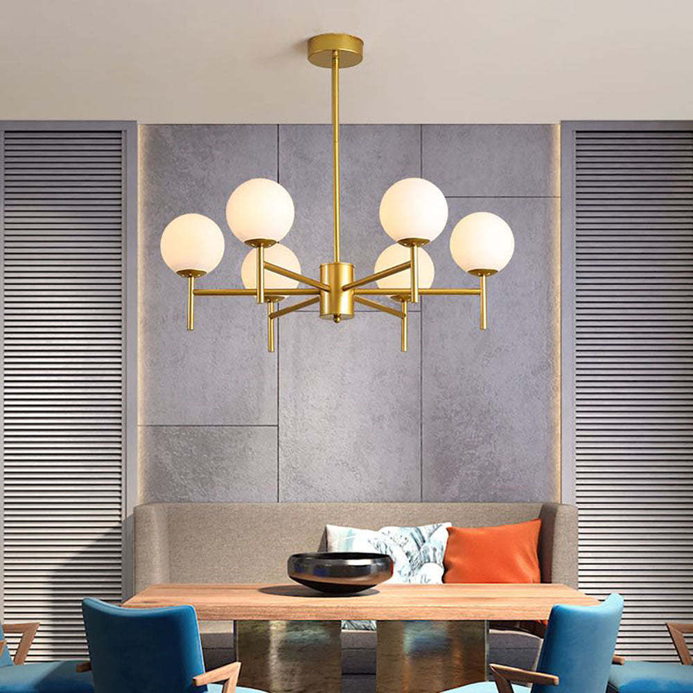 Gold Alessio globe pendant light in dining room