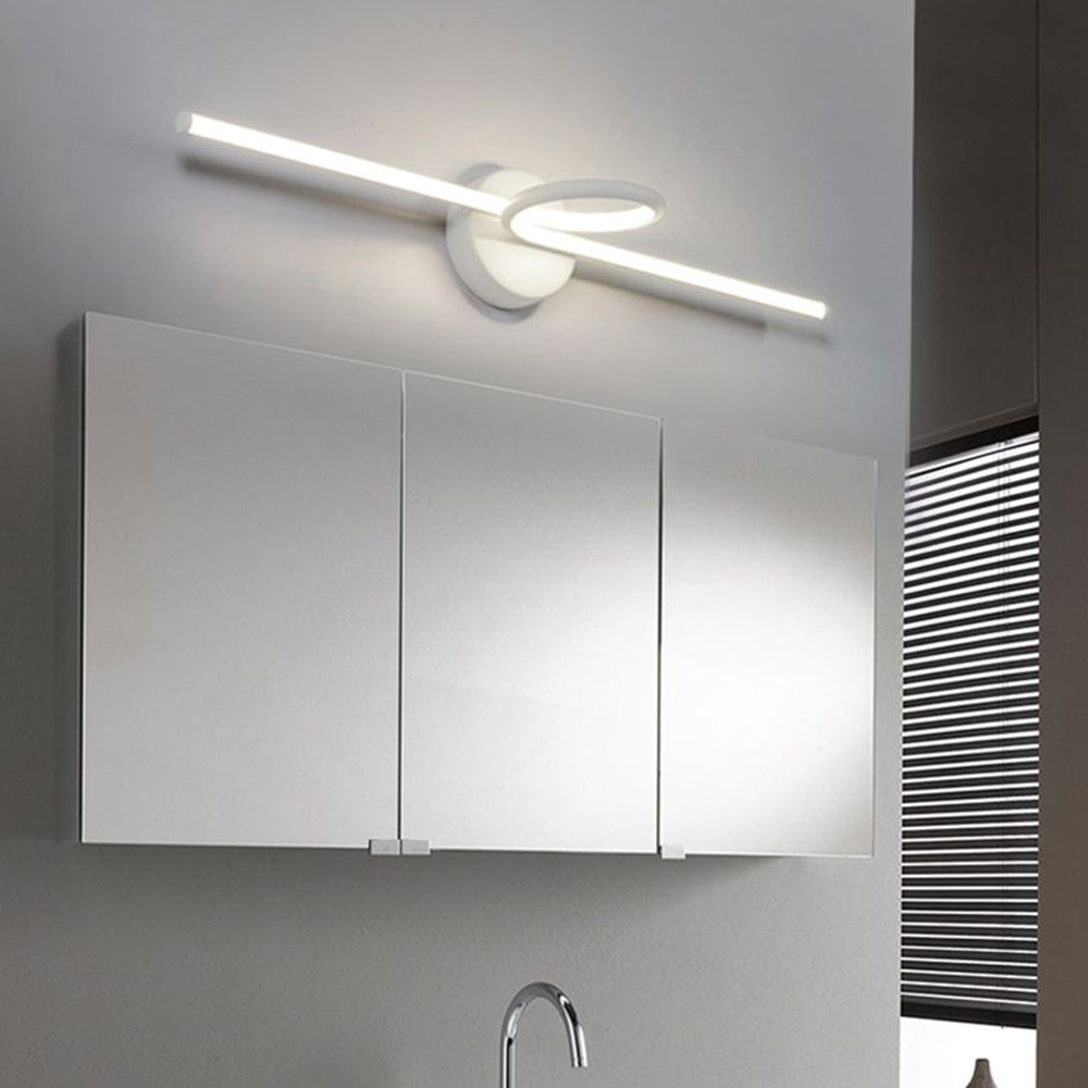 Leigh LED Vanity Wall Lamp above mirrored cabinet.