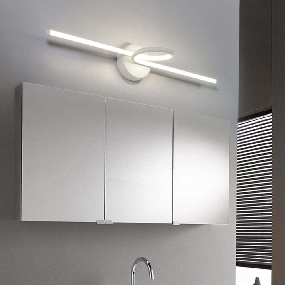 Leigh LED Vanity Wall Lamp above mirrored cabinet.