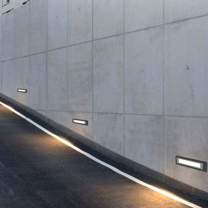 Orr LED outdoor deck lights on concrete wall.