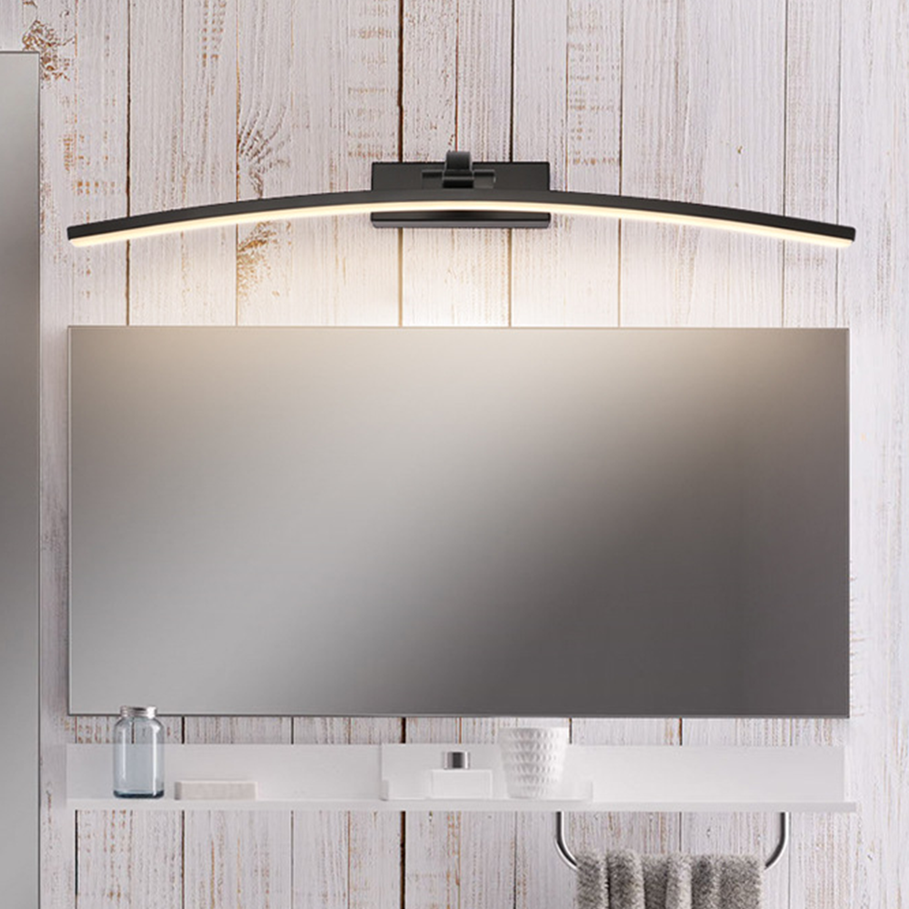 Modern curved wall lamp above a bathroom mirror