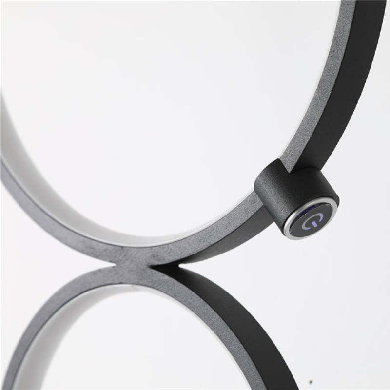 Arisha floor lamp power button. Modern lighting detail.
