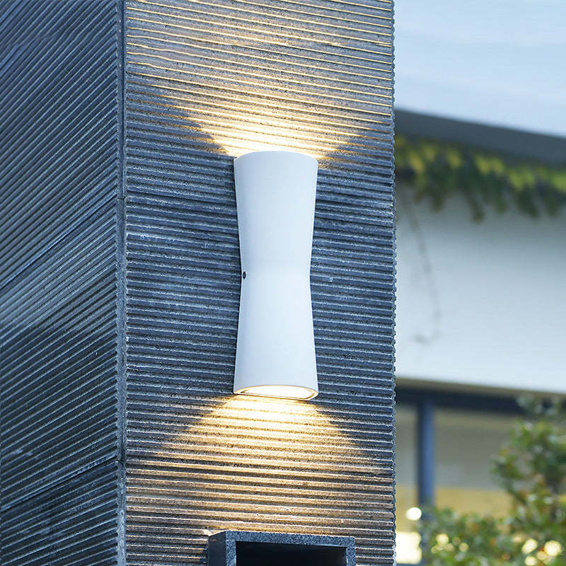 Minimalist Outdoor Wall Lamp illuminating a garden wall