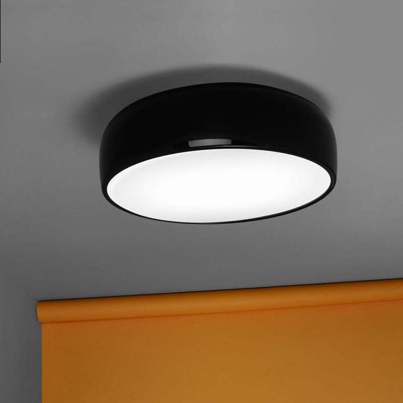 Black Leilani Disc Ceiling Light illuminating