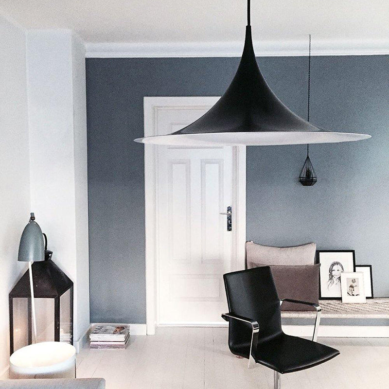 Modern black pendant light in living room interior