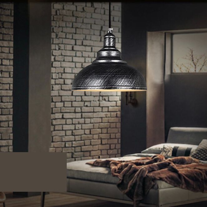 Silver Cooley pendant light in bedroom, industrial metal dome.
