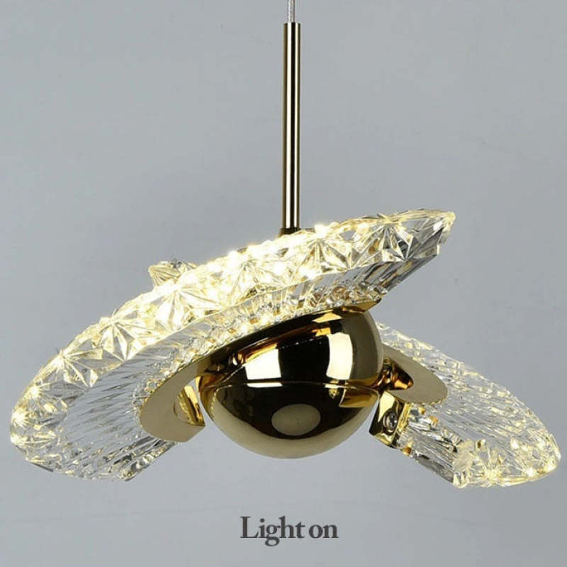 Kristy Nordic Pendant Light with crystal and gold details, lit