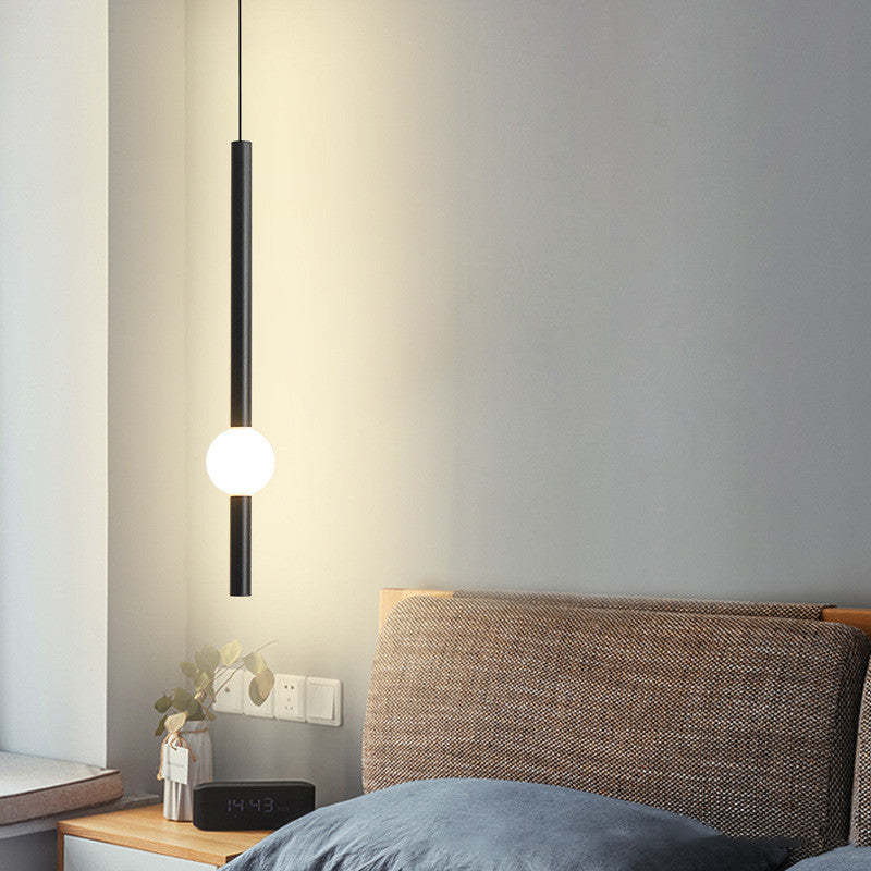 Carr Minimalist Globe Glass Pendant Light in Bedroom