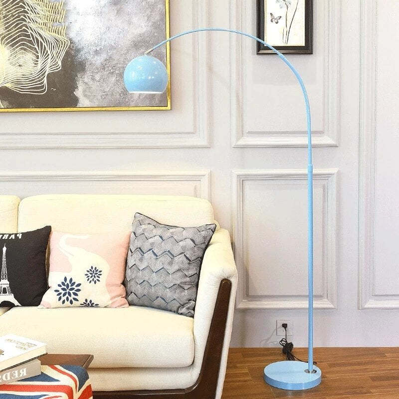 Blue arc floor lamp near sofa. Las Sola lighting. Morandi Modern Fishing 1 Light Arc Floor Lamp Metal