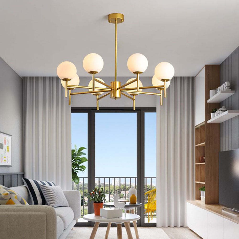 Gold Alessio globe pendant light in modern living room