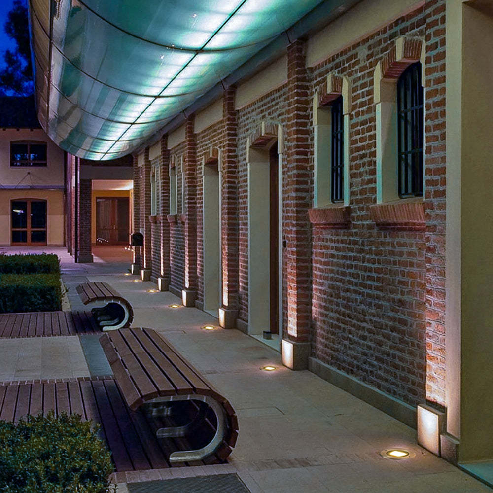 Outdoor pathway illuminated by deck step lights, modern design