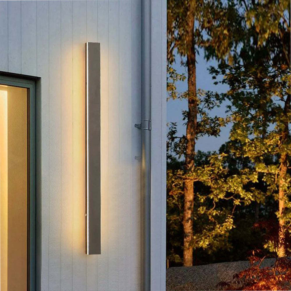 Outdoor wall light illuminating exterior wall